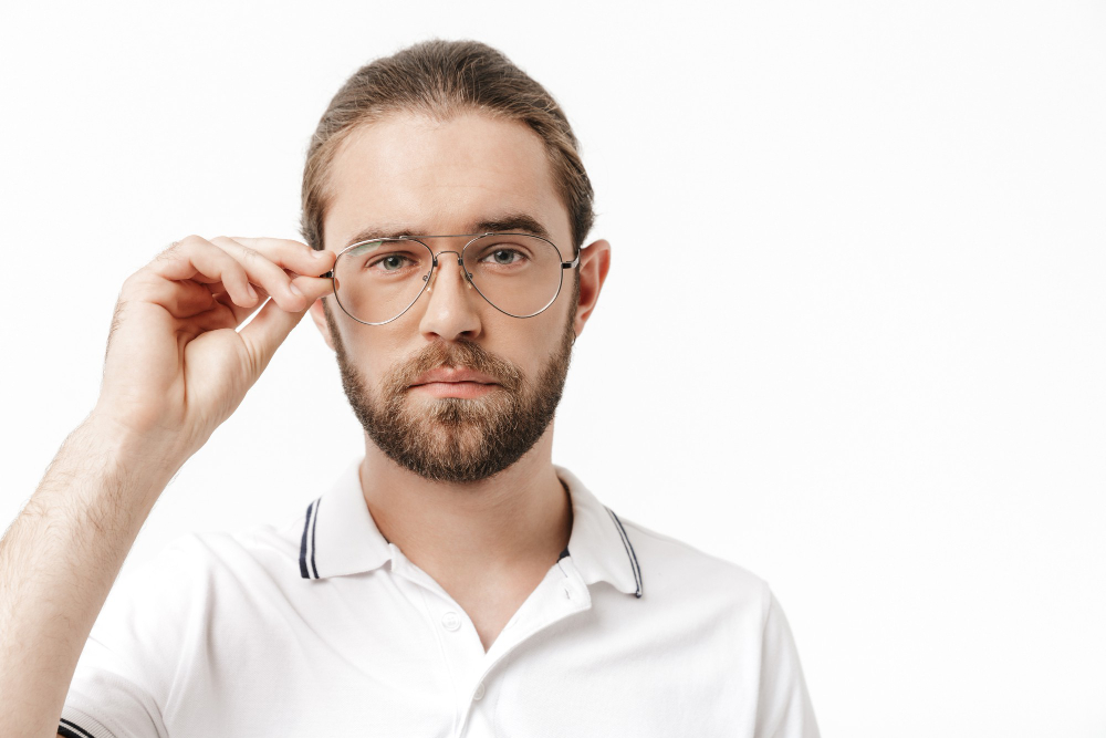 attractive-confident-young-bearded-man-wearing-casual-outfit-standing-isolated-over-white-wall.jpg