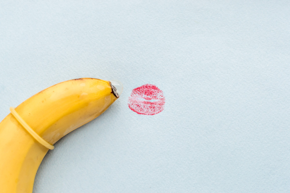 banana-in-condom-and-an-imprint-of-red-lips-concept-oral-sex.jpg