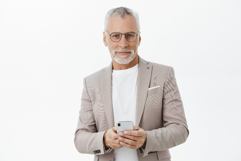 handsome-successful-old-businessman-in-suit-using-mobile-phone.jpg