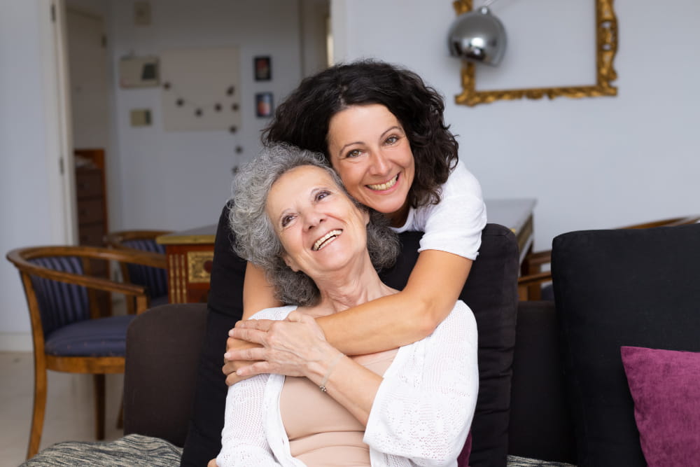 happy-middle-aged-woman-hugging-senior-lady.jpg