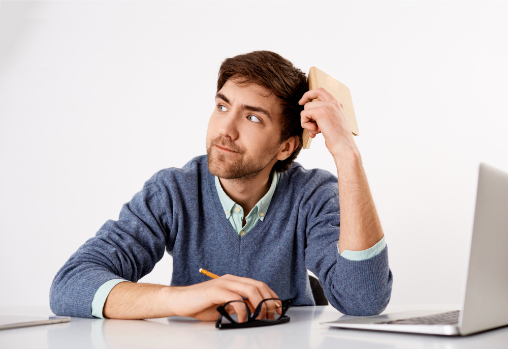 thoughtful-troubled-young-office-worker-lack-ideas-look-away-with-pouting-serious-face-trying-think-up-ideas-for-new-story-hold-planner-and-pencil.jpg